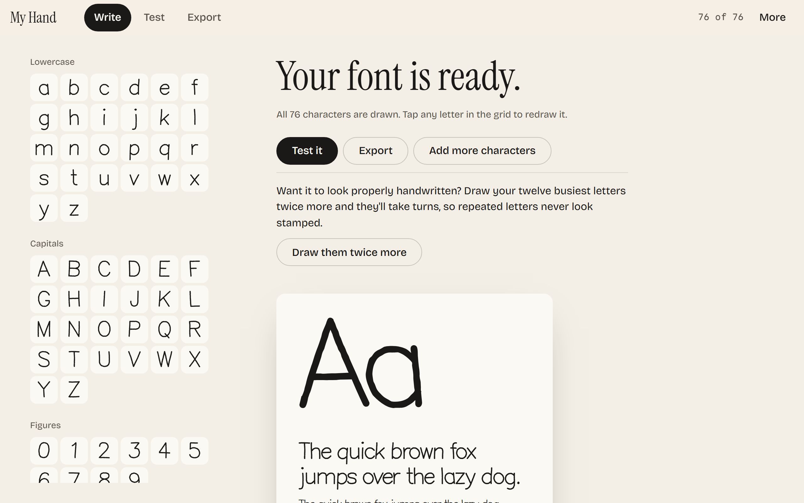 The studio with every character drawn, showing a specimen poster for the finished handwriting font.